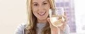 Wine Magic wih femail holding a glass of white wine