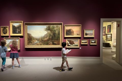 A young boy walking through  Albany Institute of Art and History