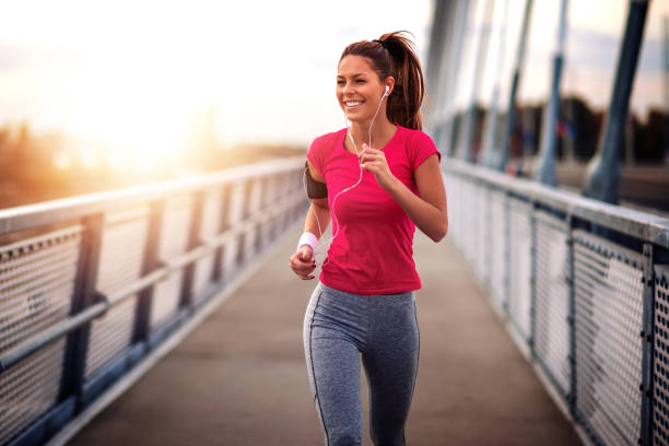 HEALTH AND FITNESS. A woman jogging.