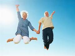 SELF HELP AND PERSONAL GROWTH. A picture of an elderly couple jumping up.