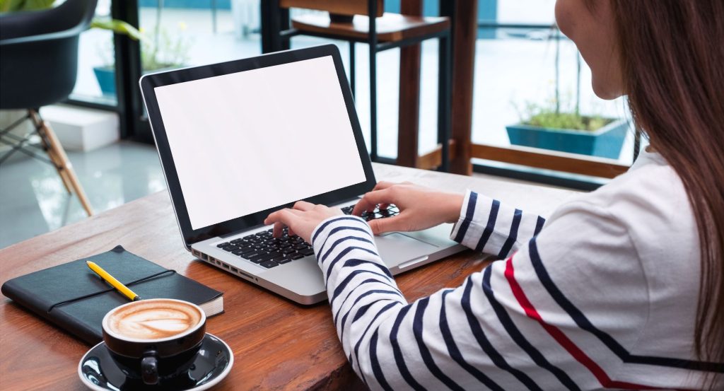 The New Tech Savvy Generation (Gen Z ). A young lady typing on a computer.