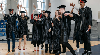 EDUCATION AND CAREER DEVELOPMENT.  picture of college graduates excited about graduating.