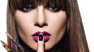 All THINGS BEAUTY AND COSMETICS  A picture of a woman with her finger over her mouth.